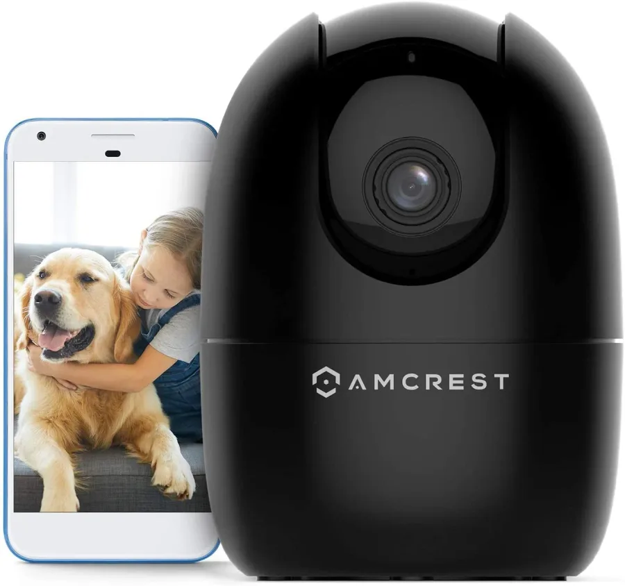 Amcrest wifi security camera next to a smartphone showing a live view of a girl hugging a dog