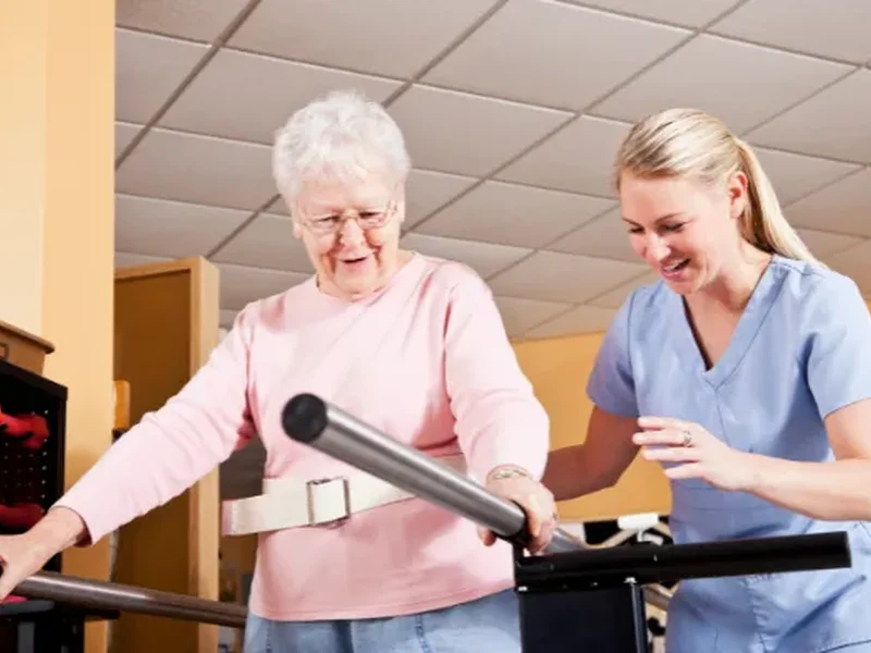 Physical therapist assessing a patient's movement related to balance & gait disorders