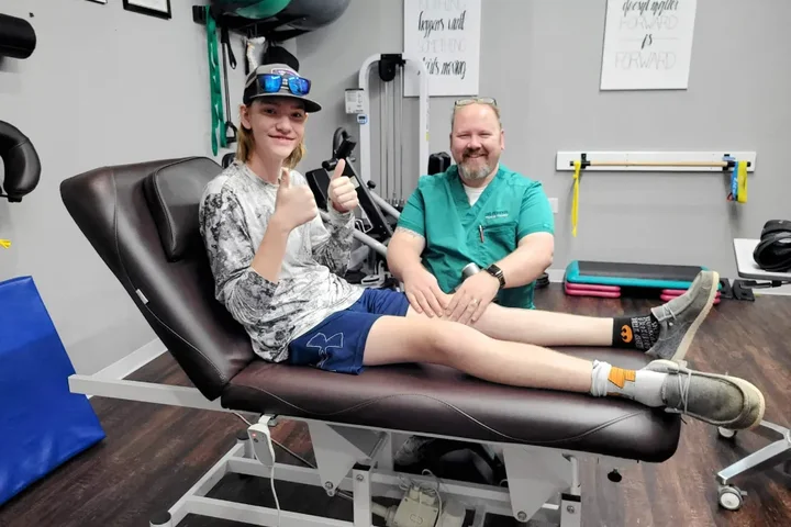 A patient and a Dr. Pepper Physical Therapy team member at the end of a treatment session