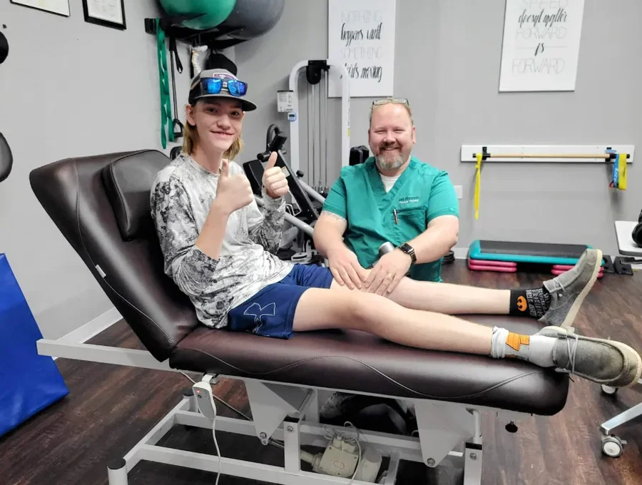A Dr. Pepper Physical Therapy team member with a patient at the end of a one-on-one session