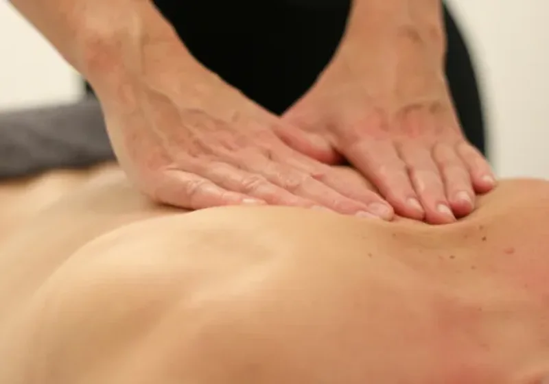 Therapist providing recovery-focused soft tissue massage
