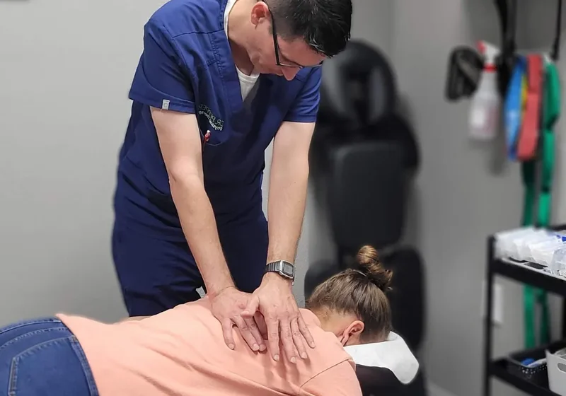 Doctor of Physical Therapy performing a spinal adjustment